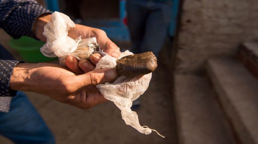 A farmer displays a piece of cannabis resin (hashish) near the town of Ketama in Morocco's northern Rif region on September 13, 2017.
Moroccan law bans the sale and consumption of the drug. But that hasn't stopped farmers in Ketama growing vast plantations of it, providing a living to some 90,000 households. Northern Morocco, a key production centre for hashish headed for Europe, has also seen an influx of European visitors eager to sample the region's weed. / AFP PHOTO / FADEL SENNA