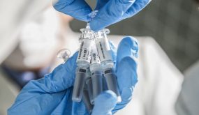 BEIJING, March 16, 2020 -- A staff member displays samples of the COVID-19 inactivated vaccine at Sinovac Biotech Ltd., in Beijing, capital of China, March 16, 2020. China has approved two COVID-19 inactivated vaccine candidates for clinical trials, according to the State Council joint prevention and control mechanism against the coronavirus Tuesday. The two vaccine candidates were developed by Wuhan Institute of Biological Products under the China National Pharmaceutical Group, and Sinovac Research and Development Co., Ltd, a company based in Beijing. Clinical trials of the two vaccines have started. (Photo by Zhang Yuwei/Xinhua via Getty) (Xinhua/Zhang Yuwei via Getty Images)