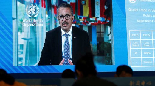 A screen shows WHO Director-General Tedros Adhanom Ghebreyesus delivering a speech via video for the opening ceremony of the 2020 China International Fair for Trade in Services (CIFTIS), at a media centre in Beijing, China September 4, 2020. REUTERS/Tingshu Wang