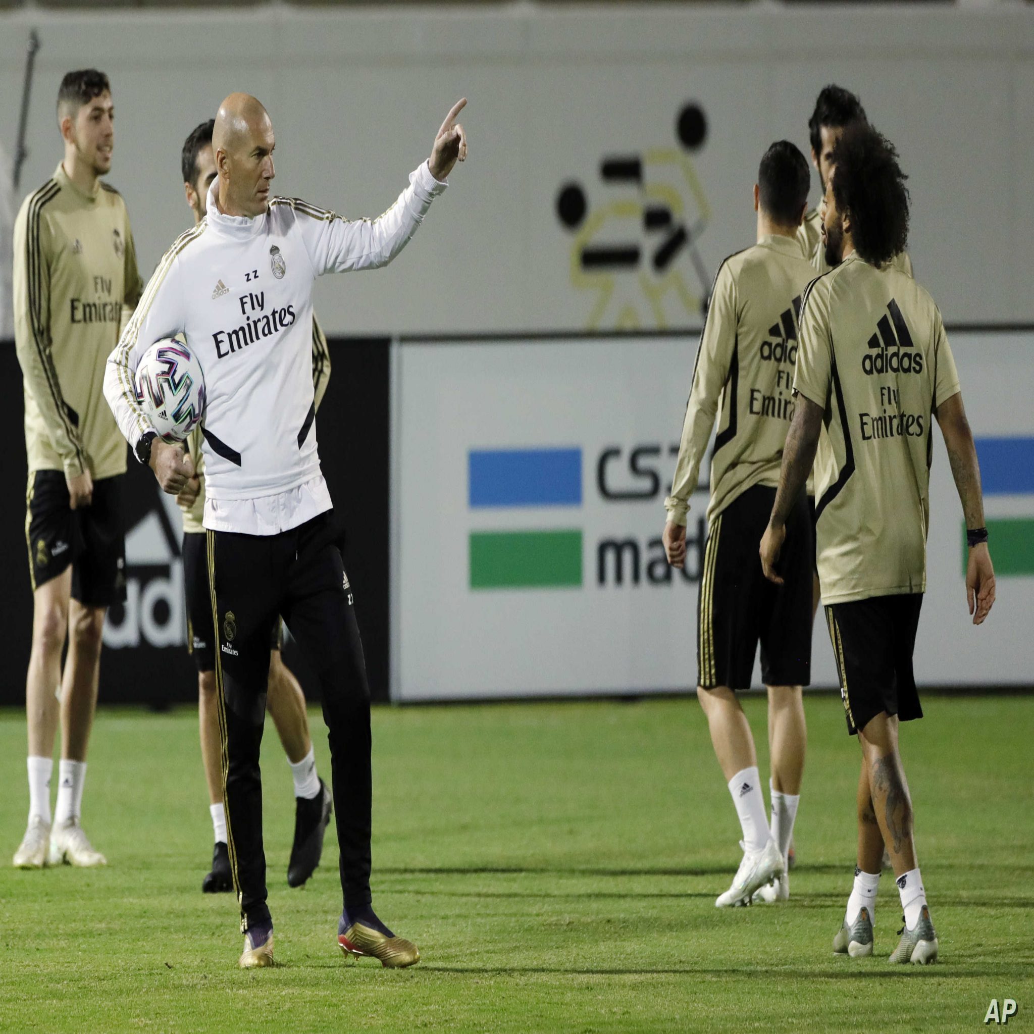 Real Madrid's head coach Zinedine Zidane, center, leads his team training session in Jiddah, Saudi Arabia, Saturday, Jan. 11, 2020, ahead of their Spanish Super Cup Final soccer match against Atletico Madrid at King Abdullah stadium in Jiddah on Sunday. (AP Photo/Amr Nabil)
