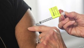 A dose of the Pfizer Covid-19 vaccine is administered on the opening day of a large-scale Covid-19 vaccination site at a parking structure at Cal Poly Pomona University in Pomona, California on February 5, 2021. - The Cal Poly Pomona site is one of two opening in California, with the other located at Moscone Center in San Francisco. According to organizers each site will ultimately have the capacity to administer up to 10,000 vaccine doses per day. (Photo by Frederic J. BROWN / AFP)