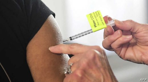 A dose of the Pfizer Covid-19 vaccine is administered on the opening day of a large-scale Covid-19 vaccination site at a parking structure at Cal Poly Pomona University in Pomona, California on February 5, 2021. - The Cal Poly Pomona site is one of two opening in California, with the other located at Moscone Center in San Francisco. According to organizers each site will ultimately have the capacity to administer up to 10,000 vaccine doses per day. (Photo by Frederic J. BROWN / AFP)