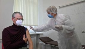 A man receives a dose of the Oxford/AstraZeneca vaccine against the coronavirus disease, marketed under the name Covishield and produced in India, at an outpatient clinic in Kiev on April 7, 2021. - Ukraine on April 7, 2021, registered another record number of coronavirus deaths and hospitalisations, with officials warning the situation is "critical". The government on April 7 reported 481 deaths in the previous day and 5,587 people taken to hospital, both the highest figures recorded since the start of the pandemic. (Photo by Genya SAVILOV / AFP)
