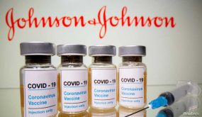 FILE PHOTO: Vials with a sticker reading, "COVID-19 / Coronavirus vaccine / Injection only" and a medical syringe are seen in front of a displayed Johnson & Johnson logo in this illustration taken October 31, 2020. REUTERS/Dado Ruvic/File Photo/File Photo