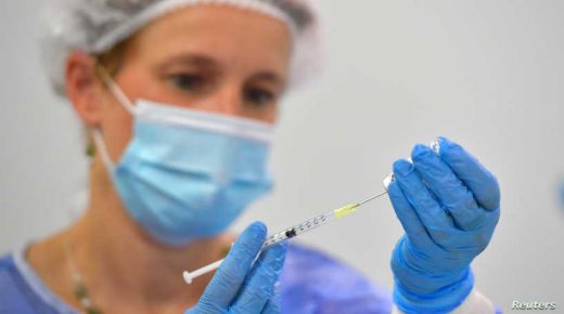 A nurse draws a dose of the BioNtech vaccine against coronavirus disease (COVID-19) at a vaccination centre at the Dresden Fair, in Dresden, Germany, July 29, 2021. REUTERS/Matthias Rietschel