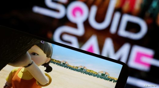 FILE PHOTO: The Netflix series "Squid Game" is played on a mobile phone in this picture illustration taken September 30, 2021. REUTERS/Kim Hong-Ji/Illustration/File Photo/File Photo