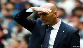Soccer Football - La Liga Santander - Real Madrid v Real Betis - Santiago Bernabeu, Madrid, Spain - May 19, 2019 Real Madrid coach Zinedine Zidane shields his eyes from the sun REUTERS/Juan Medina